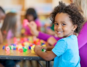 Young child engaging in a preschool setting