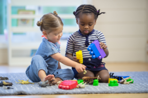 Two children sharing blocks